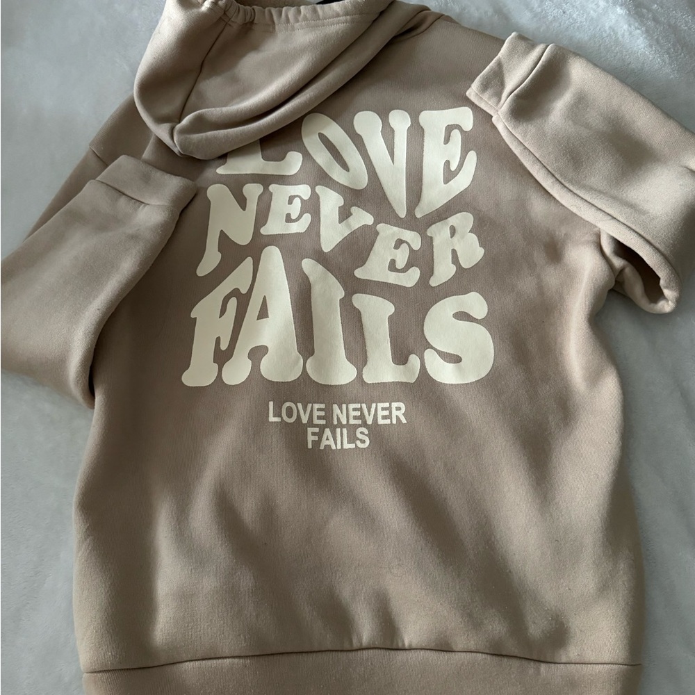 " Love never fails” hoodie size M